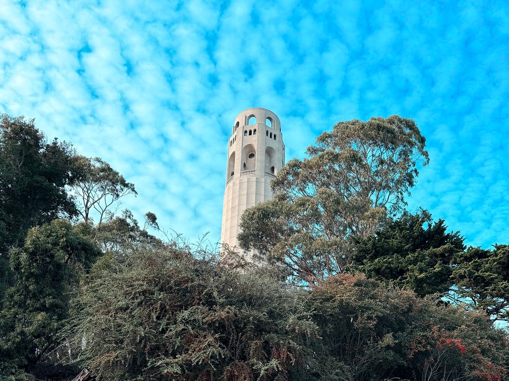 A beautiful picture of Coit Tower with blue skies and clouds in the background